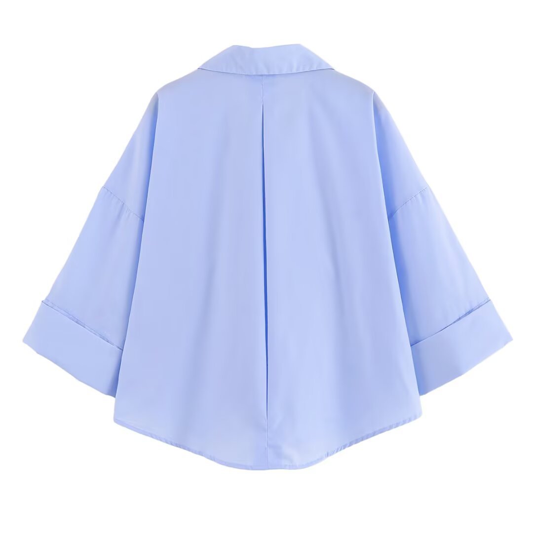 Women's blouse with oversized cut and chic lapel, size
