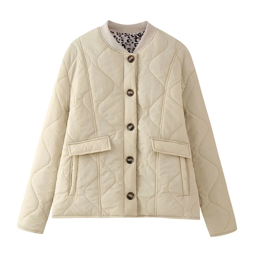 Women's quilted jacket in an elegant design with practical button closure and side pockets, size S