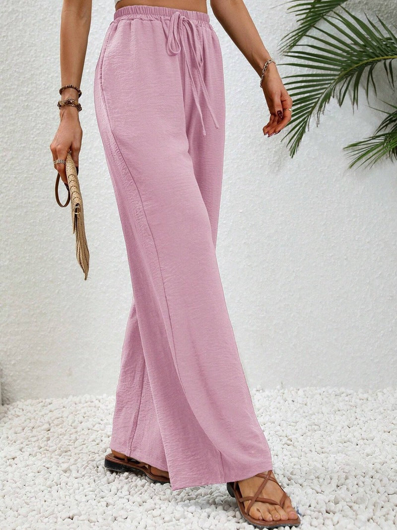 Women's casual, wide-legged leisure trousers with elasticated waistband and side pockets, size S