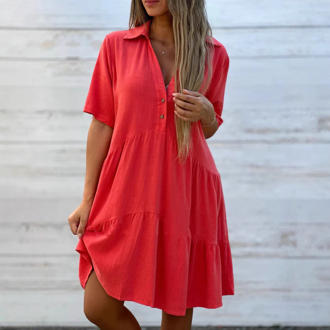 Women's loose-fitting shirt dress with button details and flowing hem, size
