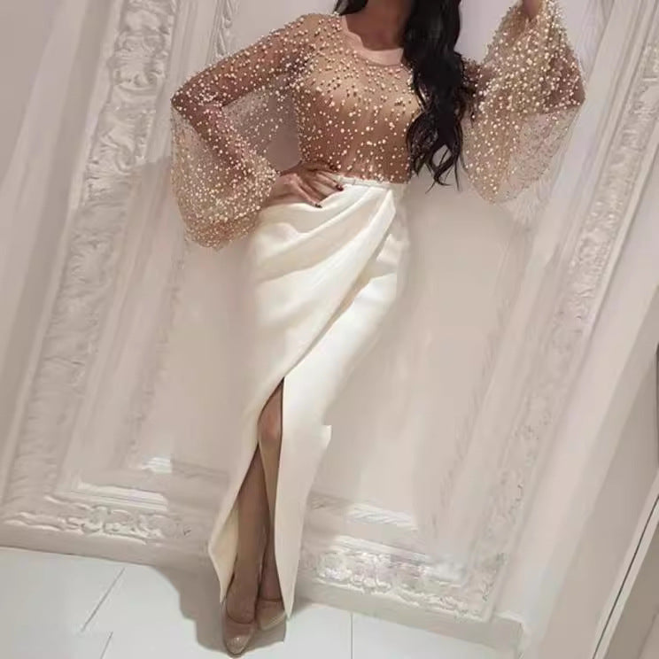 Women's long-sleeved blouse with sparkling pearl details and a figure-hugging cut, size [size missing]
