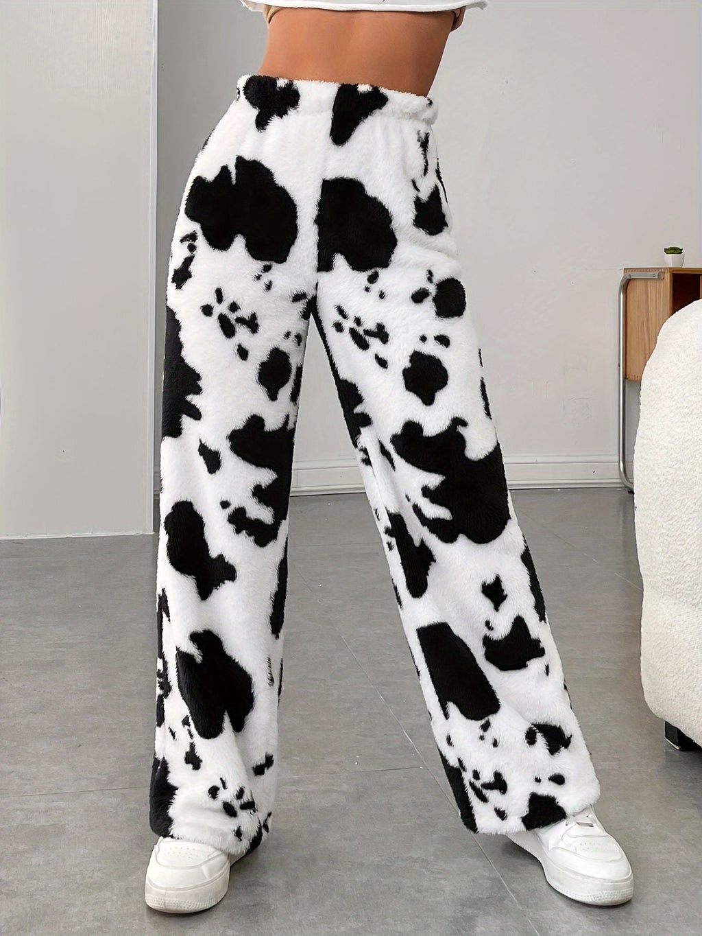 Women's fleece trousers in a trendy cow print, size