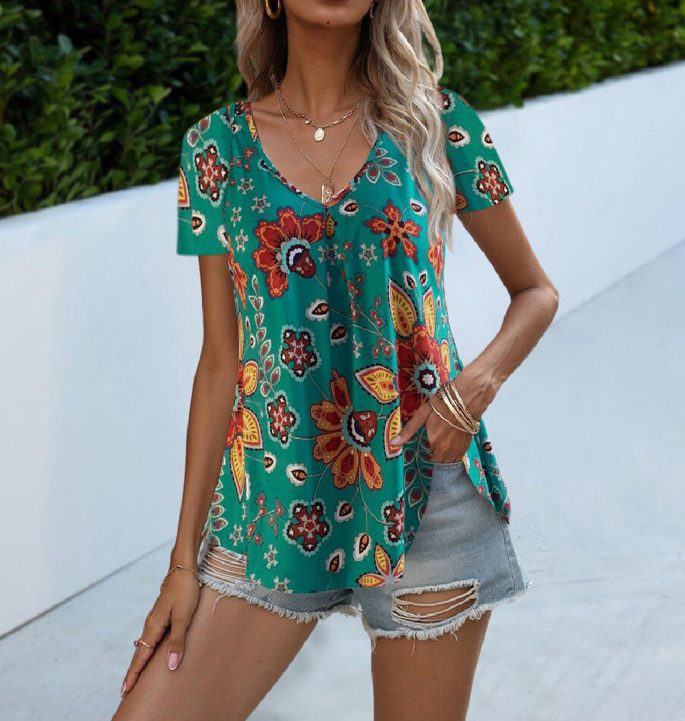 Women's floral top with deep V-neck and flowing cut, size