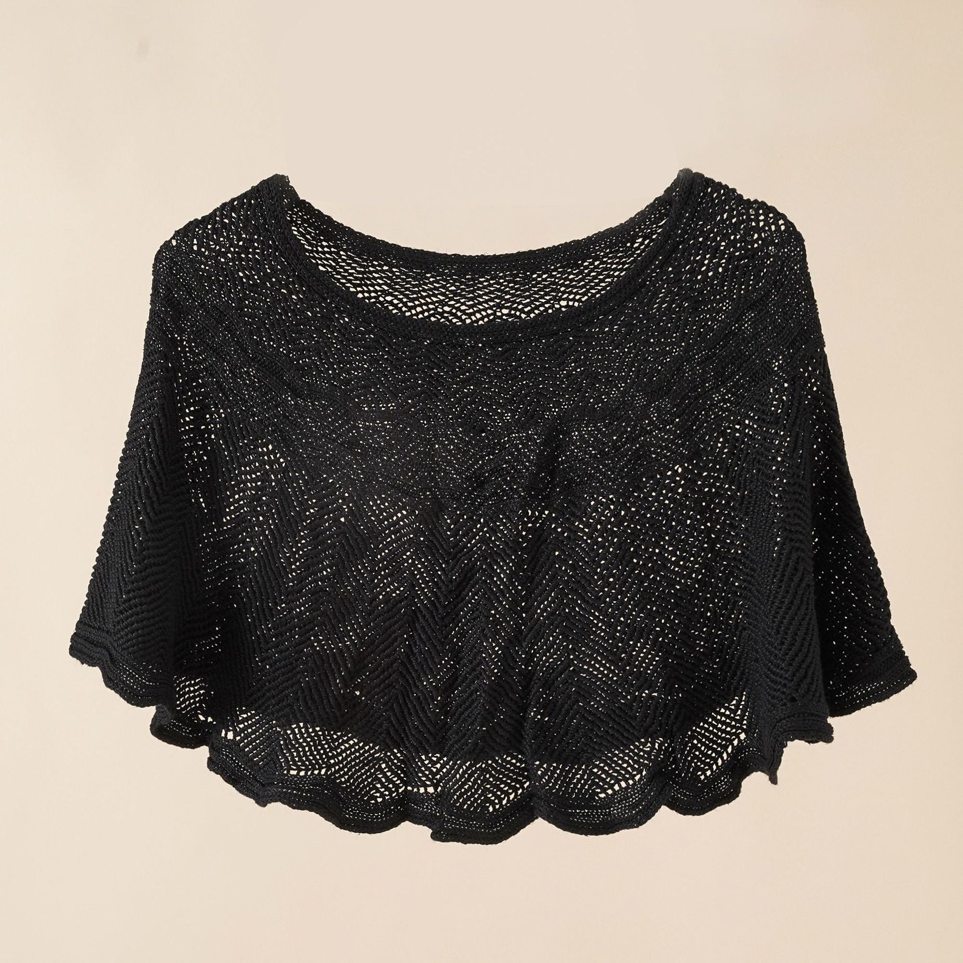 Women's airy knitted poncho in a modern design, size