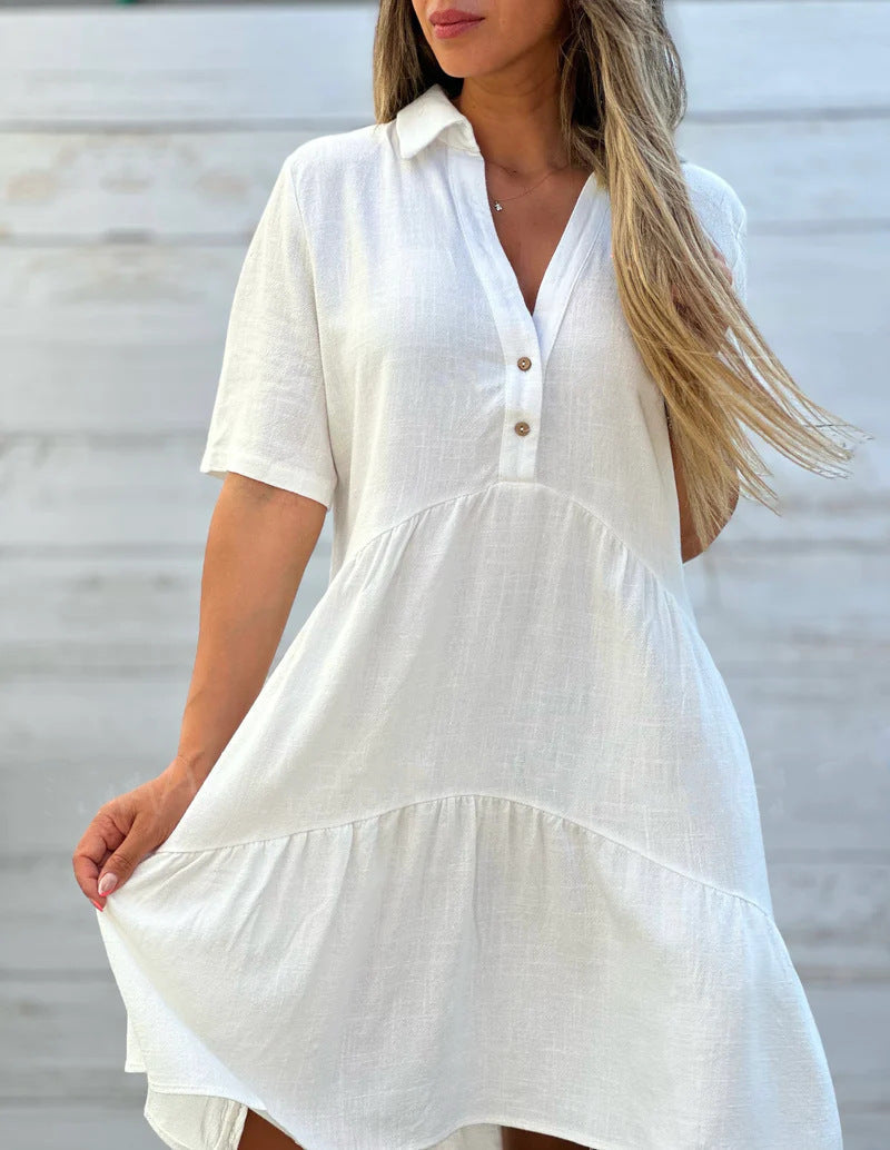 Women's loose-fitting shirt dress with button details and flowing hem, size