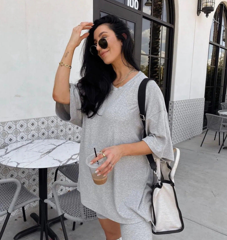 Women's comfortable oversized blouse with deep V-neck, size