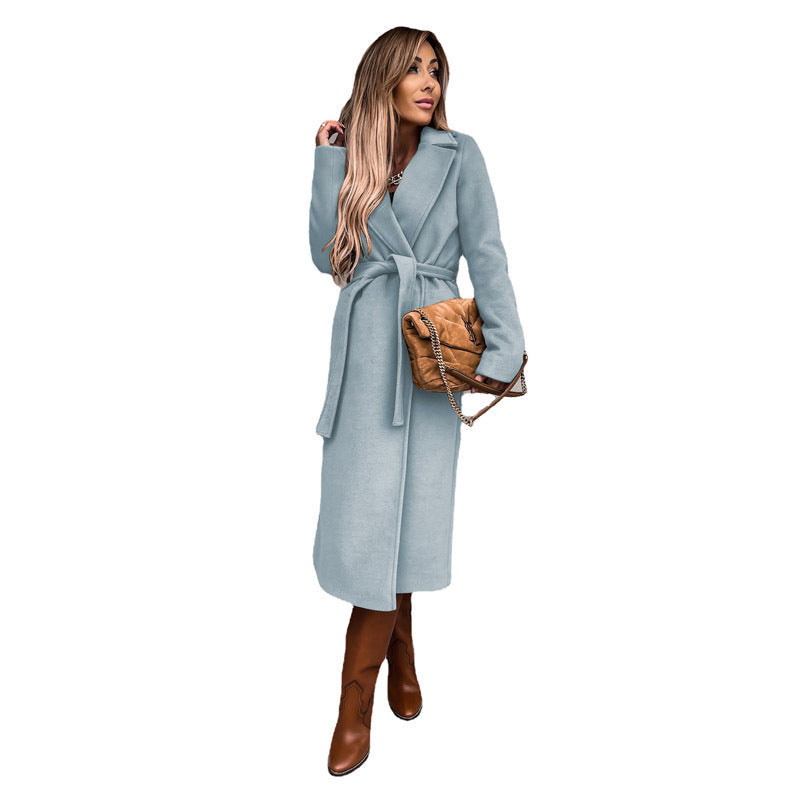Women's elegant trench coat with tie belt and textured material, size S