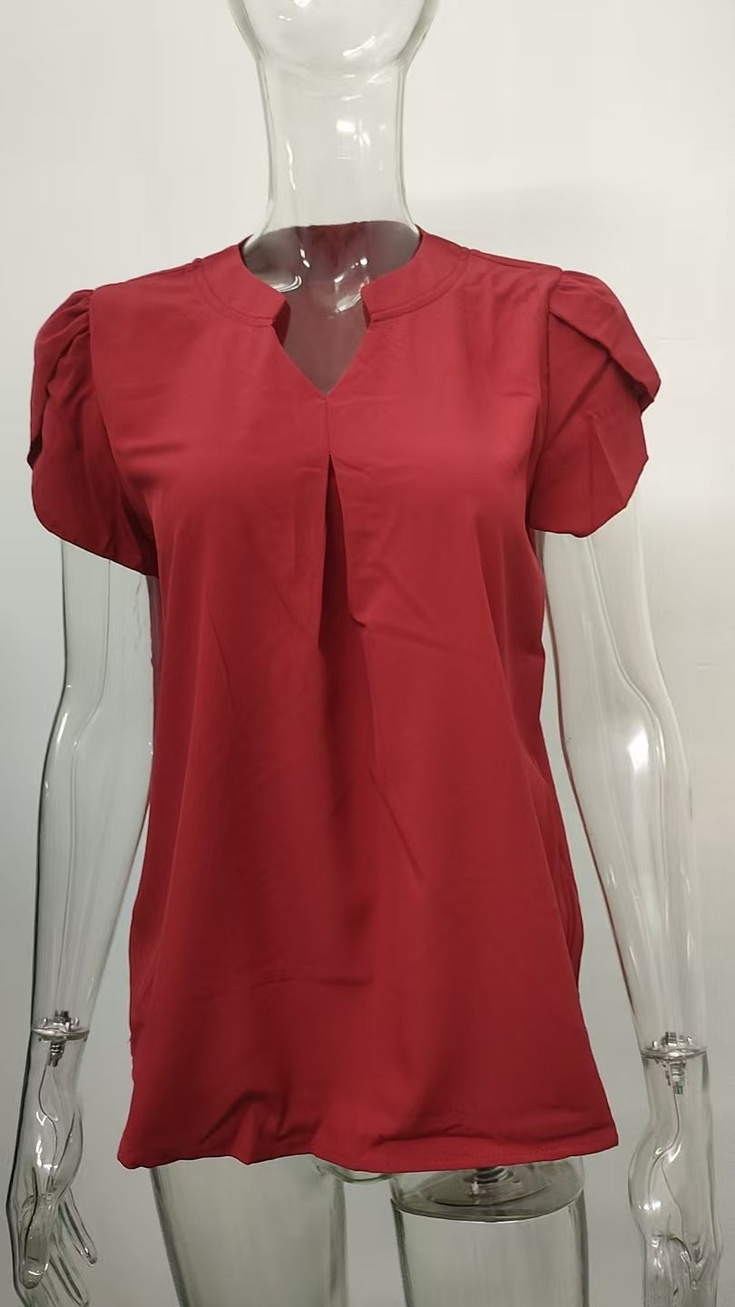 Women's blouse with elegant V-neck detail and light puff sleeves, size [size]