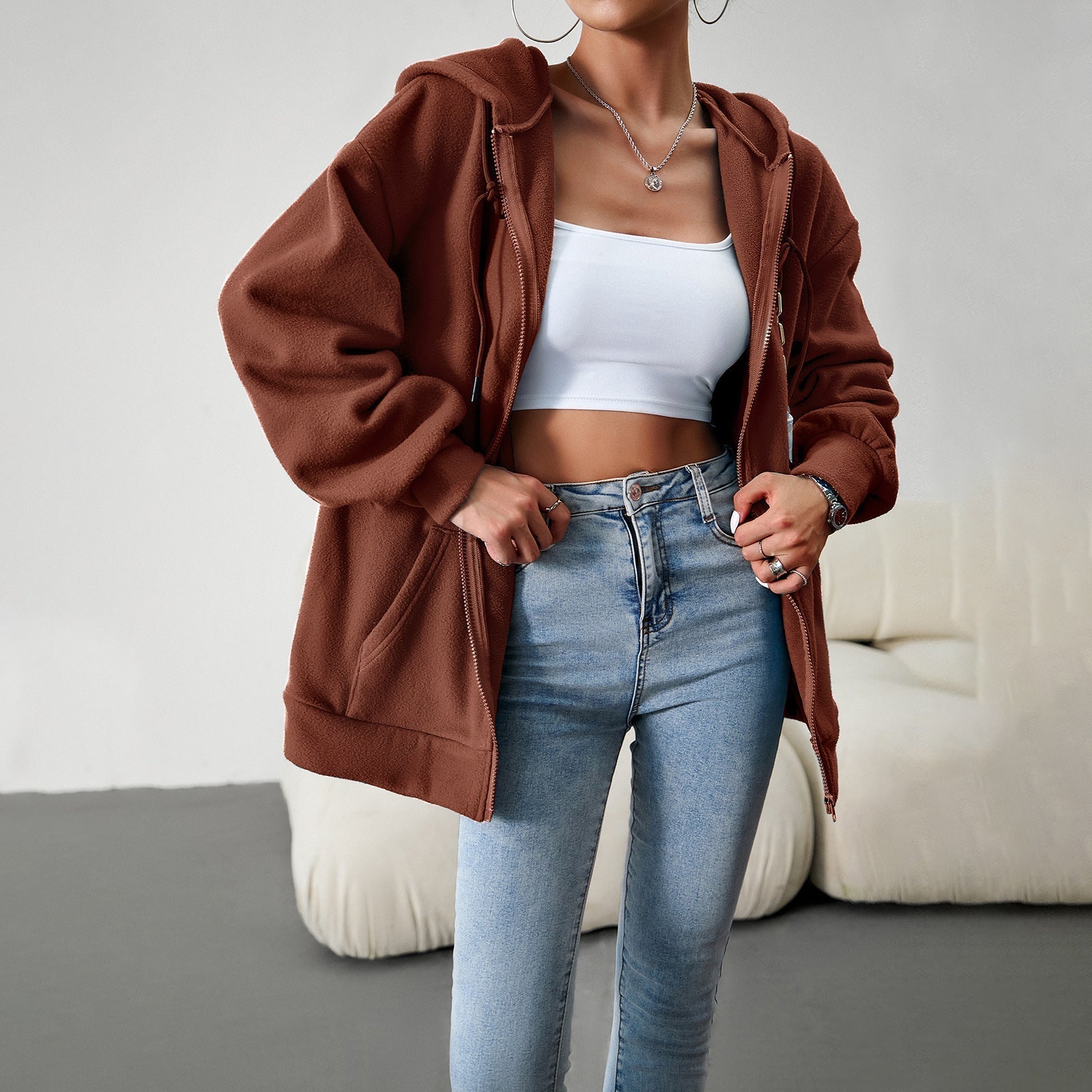 Women's fleece jacket with practical pockets and adjustable hood, size S