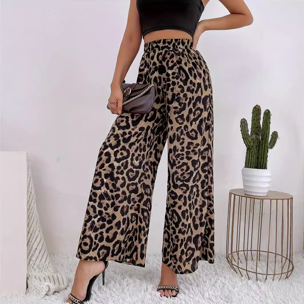 Women's wide-leg leopard print trousers in flowing material with elasticated waistband, size S