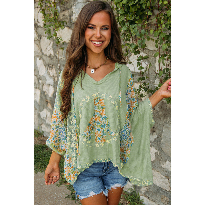 Women's casual hooded top with floral peace design, size S