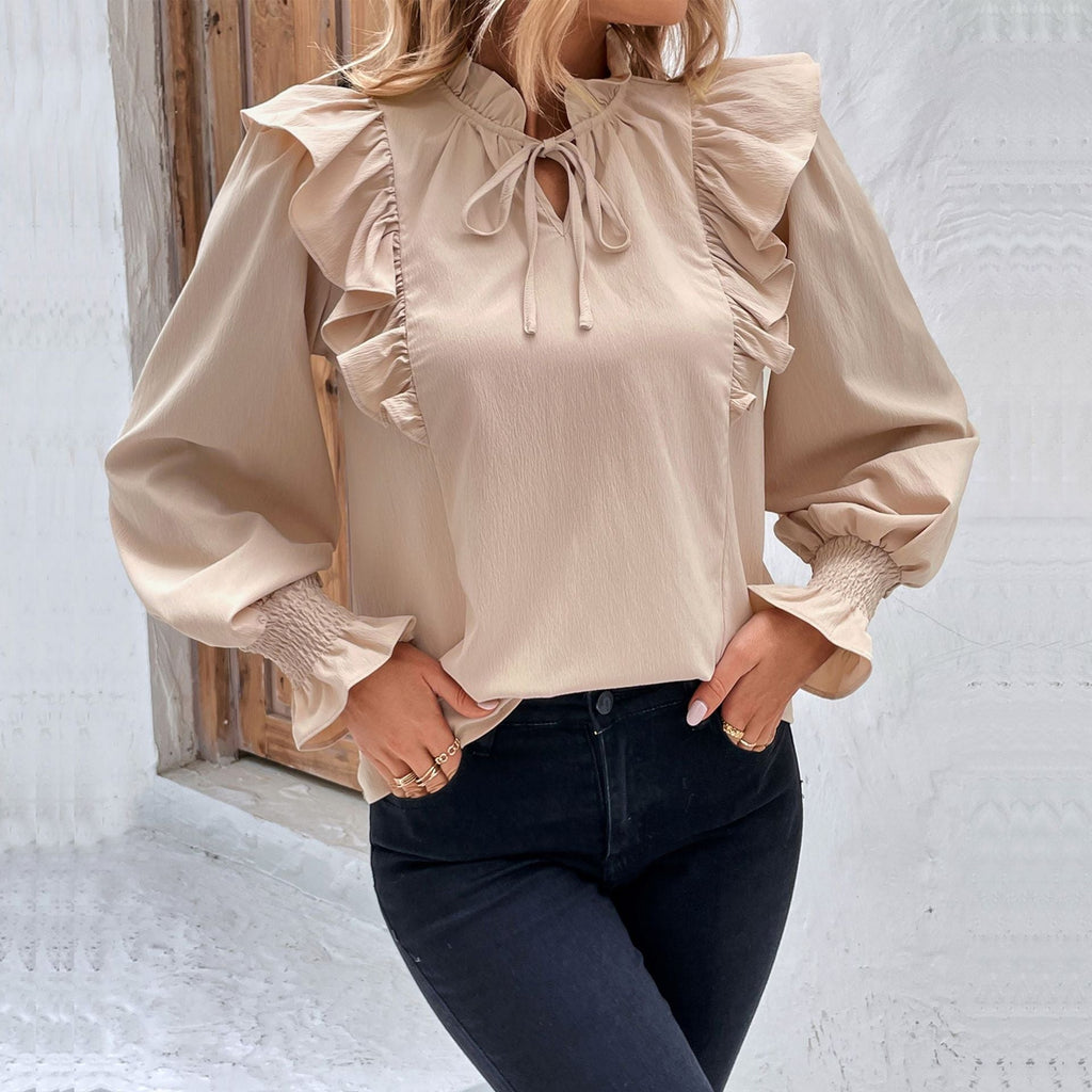 Women's blouse with elegant ruffle details and playful drawstring, size