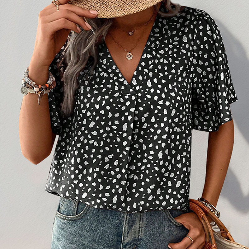 Women's short-sleeved blouse with a modern polka dot design and a relaxed fit, size [size missing]
