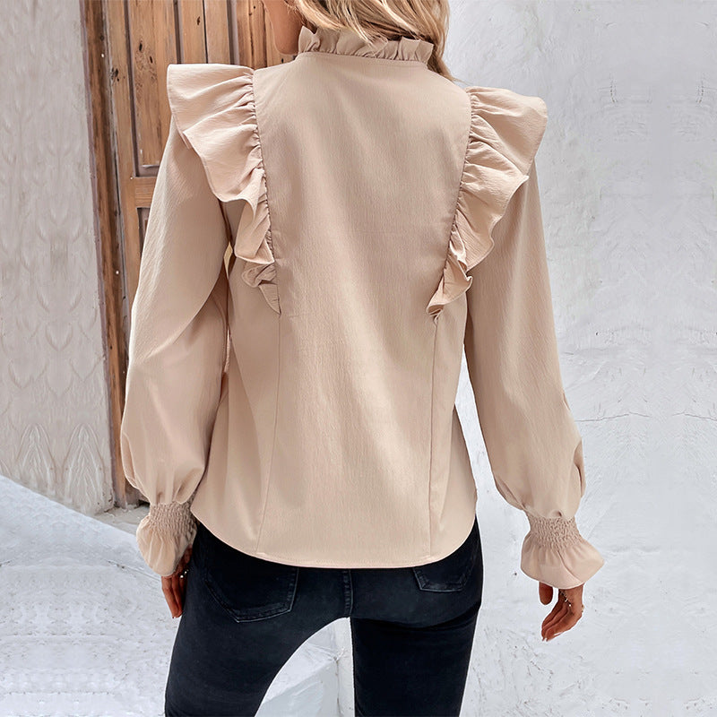 Women's blouse with elegant ruffle details and playful drawstring, size