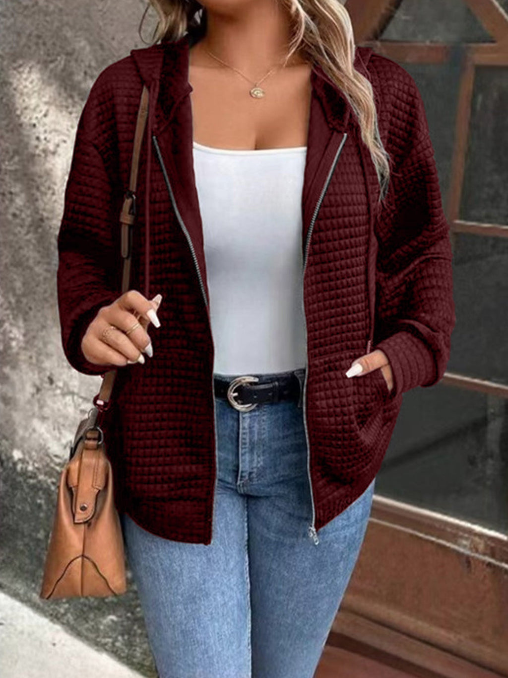 Women's loose-fitting hooded jacket with a textured waffle surface and practical pockets, size S