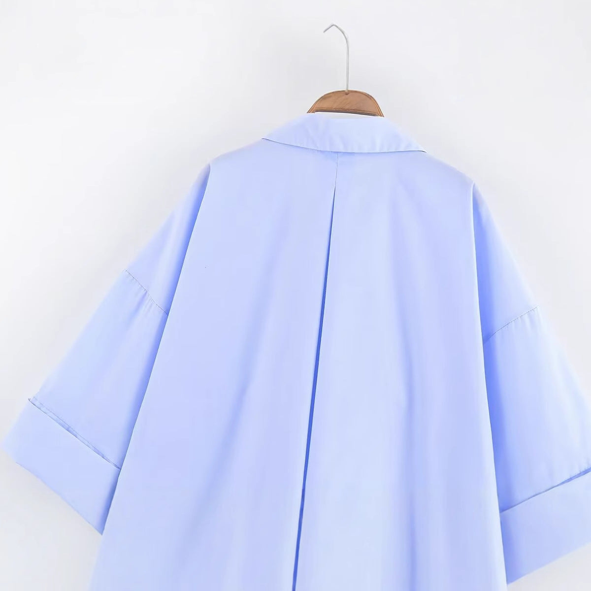 Women's blouse with oversized cut and chic lapel, size
