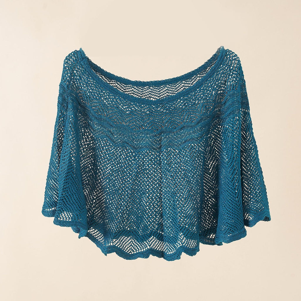 Women's airy knitted poncho in a modern design, size