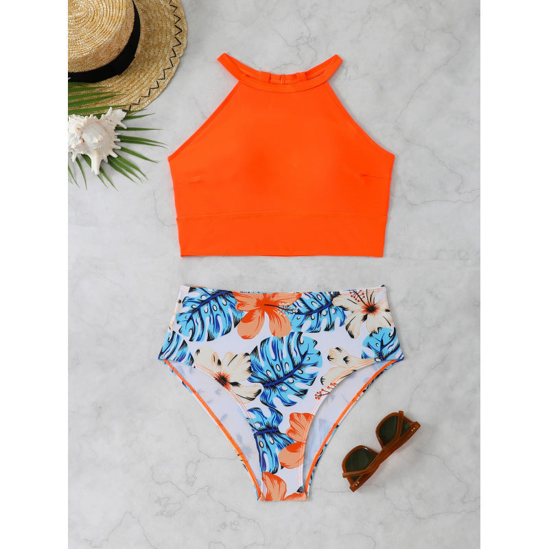 Swimsuit top with high collar and floral high-waisted bottoms, size