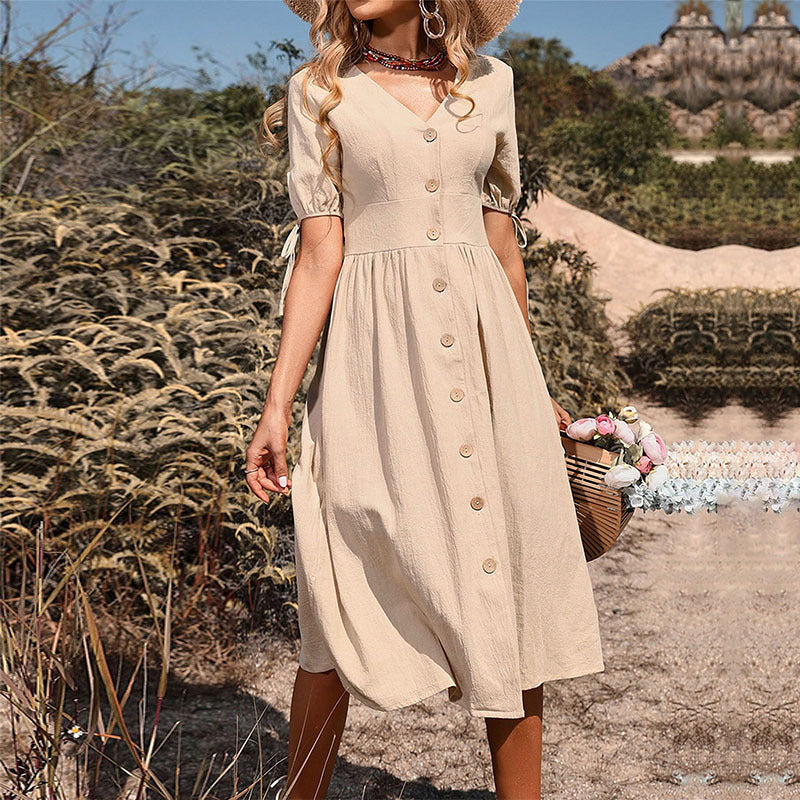 Women's midi dress with a tailored cut and modern button details, size [size]