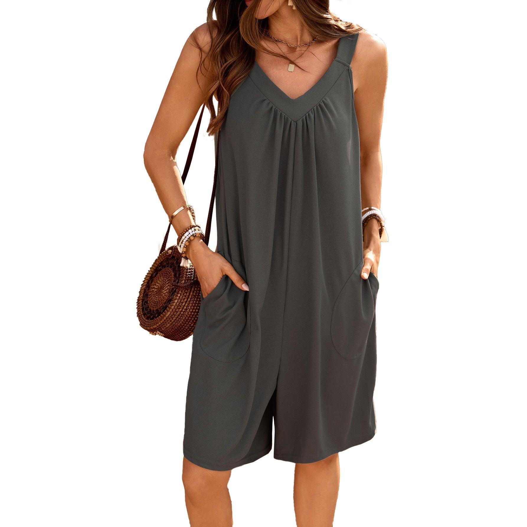 Women's sleeveless jumpsuit with deep V-neck and practical pockets, size S