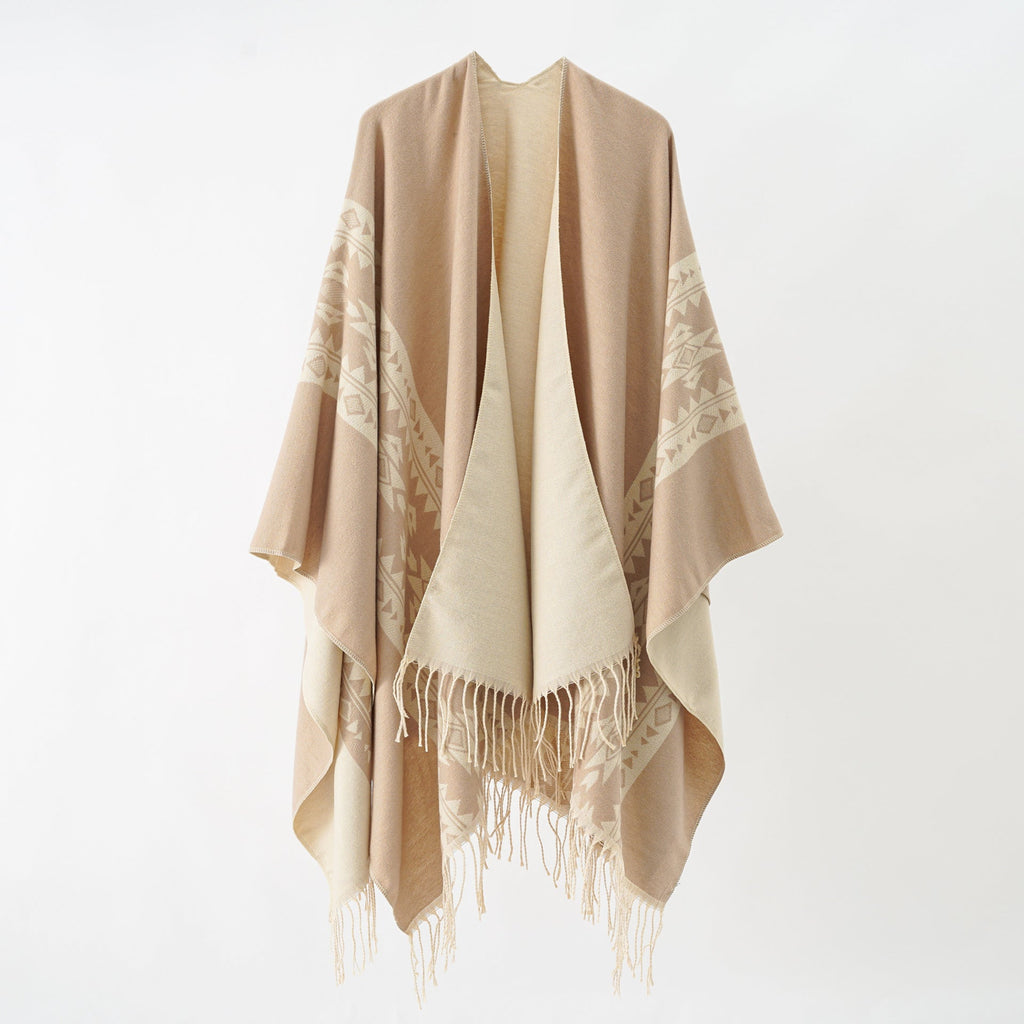 Women's elegant knitted poncho with artistic fringe and floral accents Valenzora