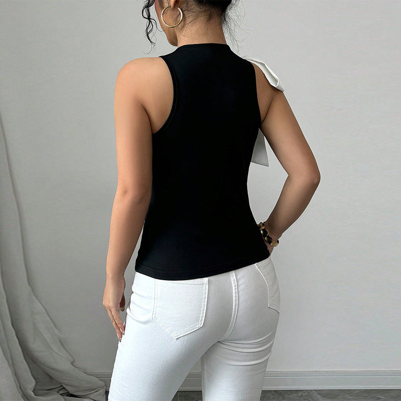 Women's sleeveless top with elegant bow appliqué, size