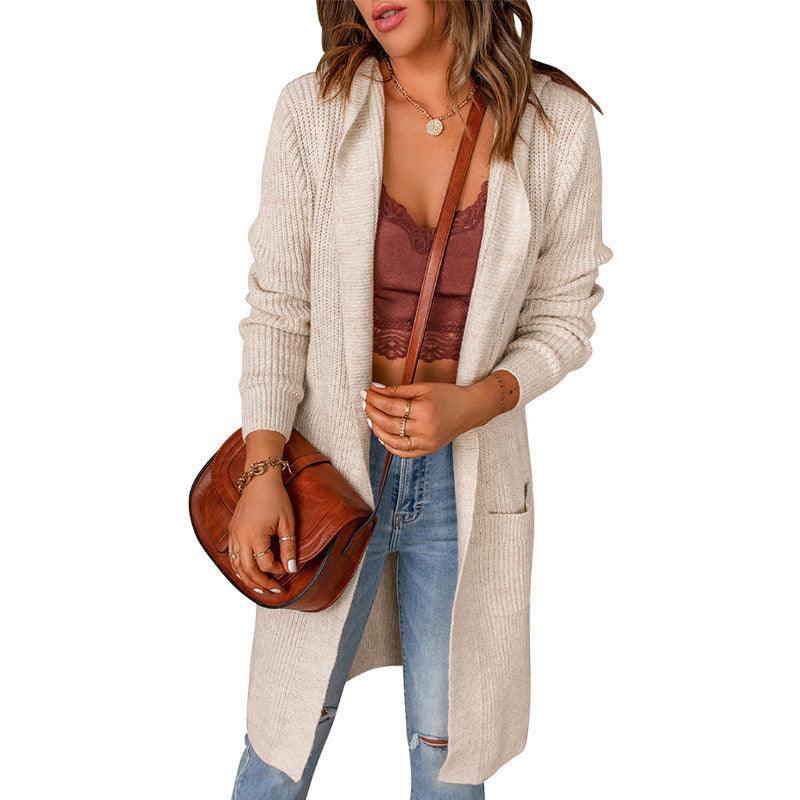Women's knitted coat with deep V-neck and generous pockets, size