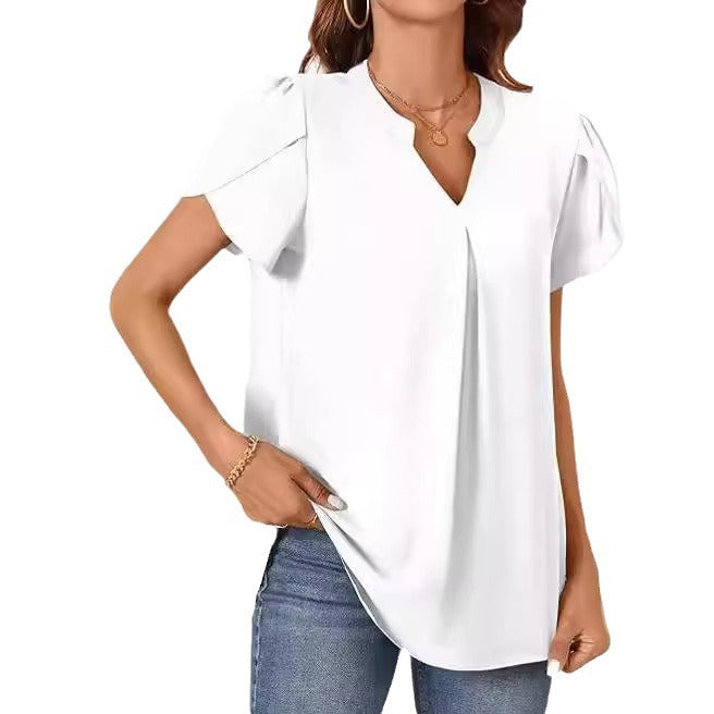 Women's blouse with elegant V-neck detail and light puff sleeves, size [size]