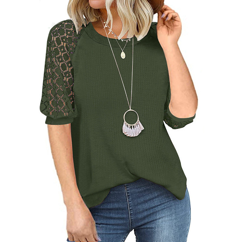 Women's top with lace sleeves and textured fabric, size
