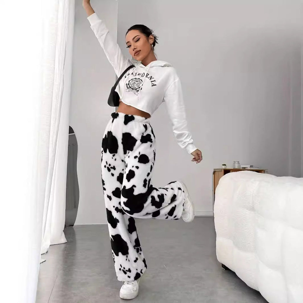 Women's fleece trousers in a trendy cow print, size