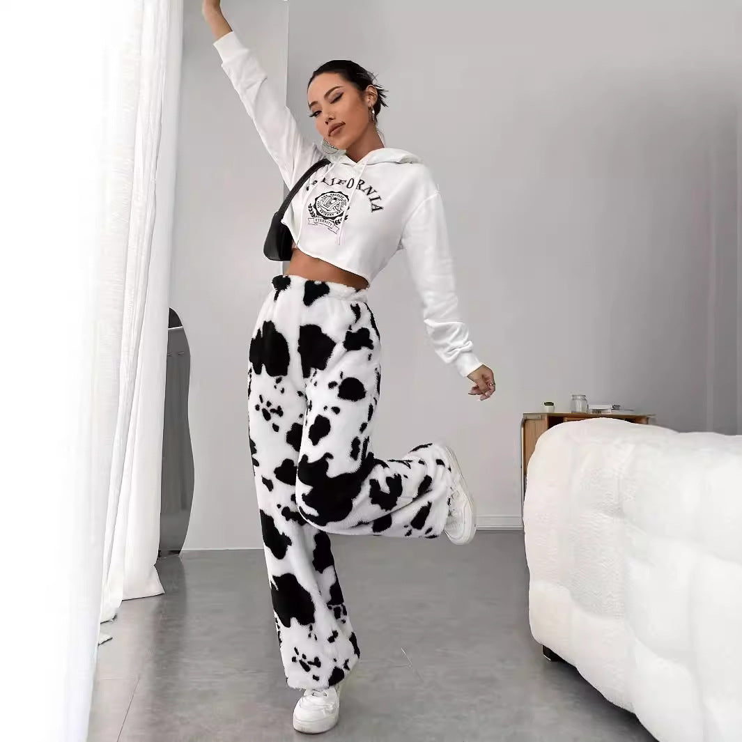 Women's fleece trousers in a trendy cow print, size