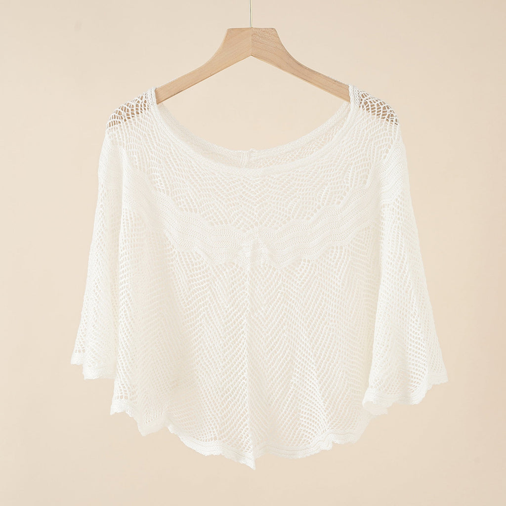 Women's airy knitted poncho in a modern design, size