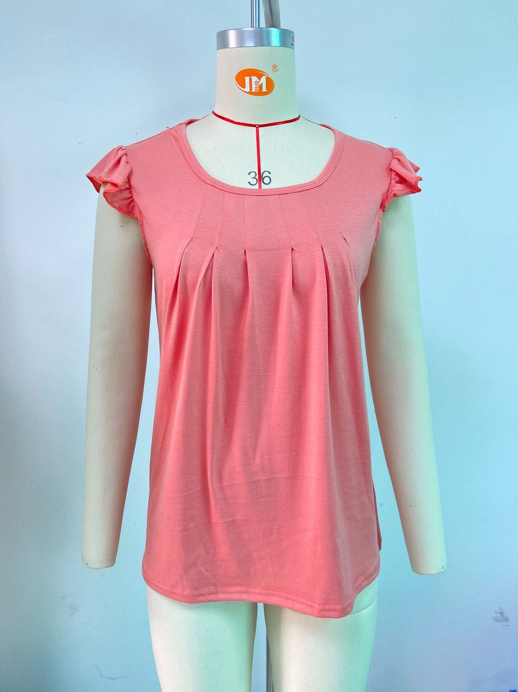 Women's sleeveless blouse with decorative ruffle details, size [size]