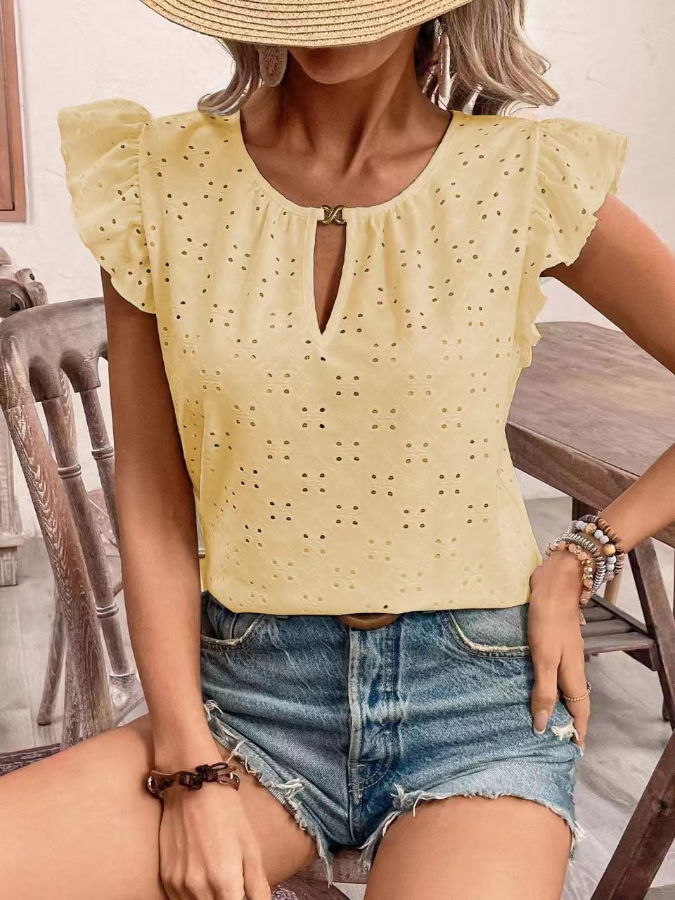 Women's blouse with ruffle details and eyelet embroidery, size