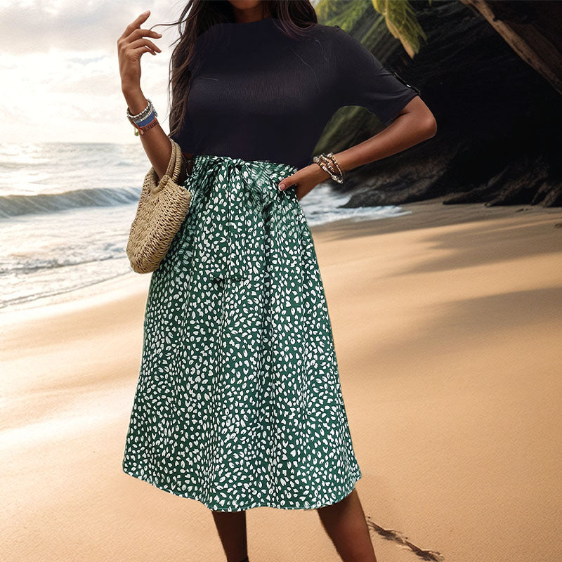 Women's midi dress with graphic polka dot design and elegant waist belt, size