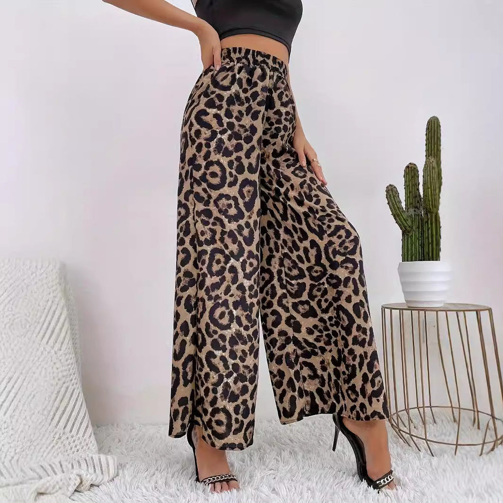 Women's wide-leg leopard print trousers in flowing material with elasticated waistband, size S