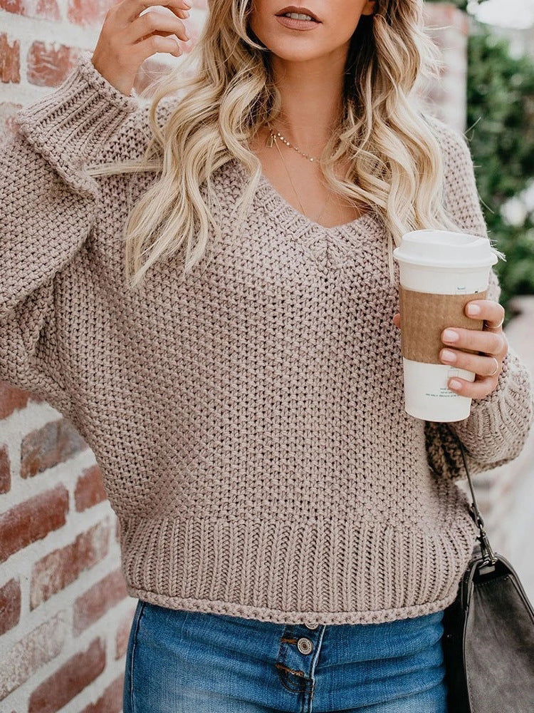 Women's chunky knit sweater with deep V-neck and relaxed fit, size