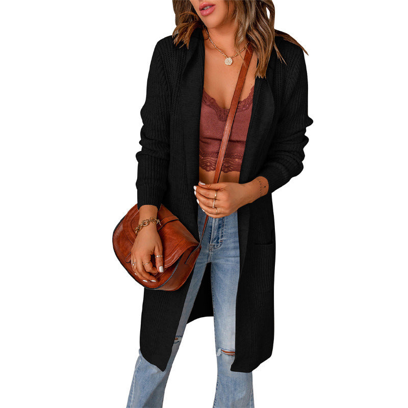 Women's knitted coat with deep V-neck and generous pockets, size