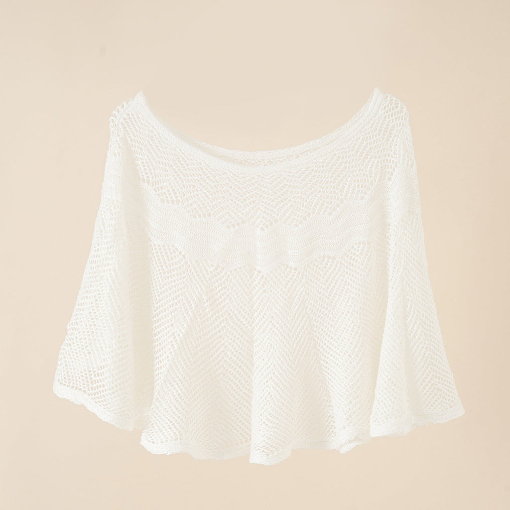 Women's airy knitted poncho in a modern design, size