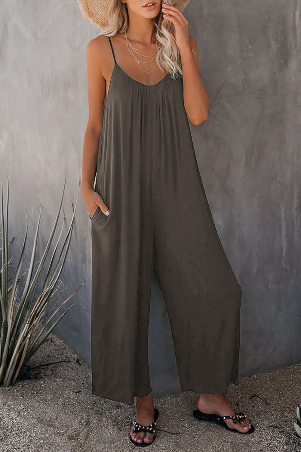 Women's casual jumpsuit with decorative straps and light, flowing fabric, size S