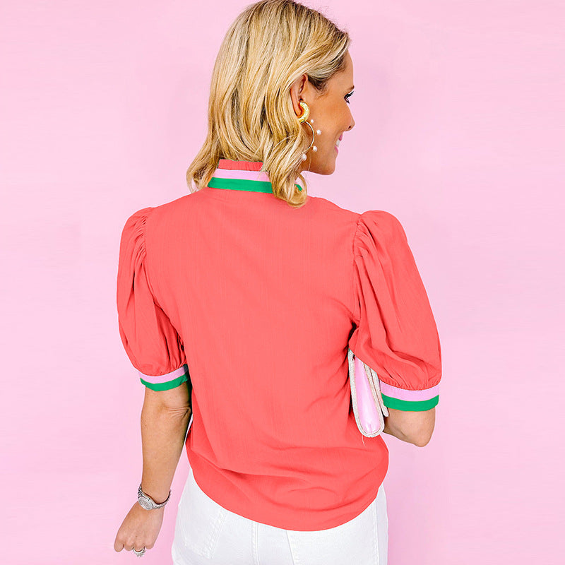 Women's blouse with stylish ruffle details and fashionable color contrast, size [size missing]