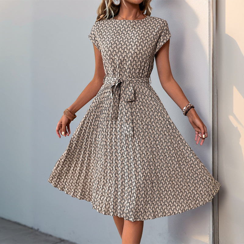 Women's midi dress with a sophisticated waist belt and playful pattern, size