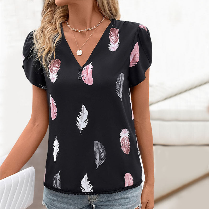 Women's blouse with romantic feather pattern and puff sleeves, size