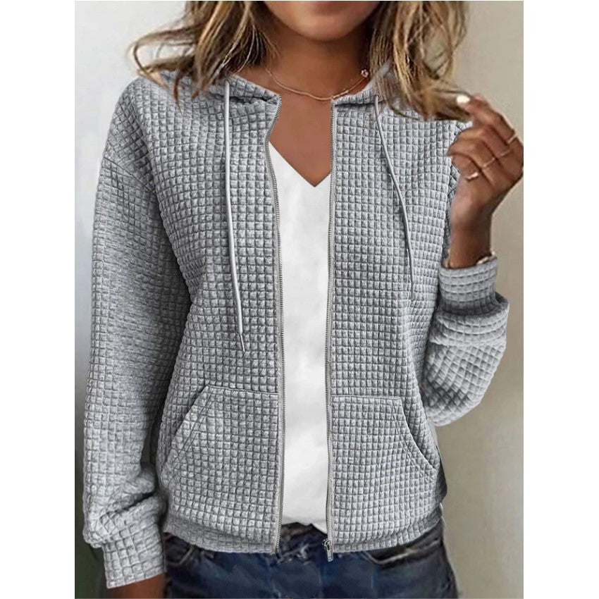 Women's waffle-textured hooded jacket with practical pockets and a modern cut, size S