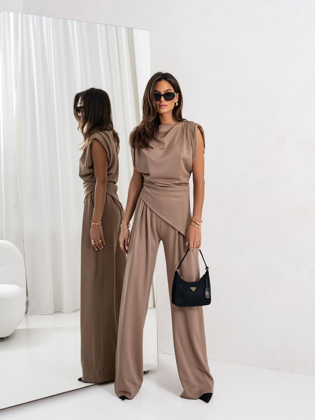 Women's elegant jumpsuit with draped details and wide leg, size S