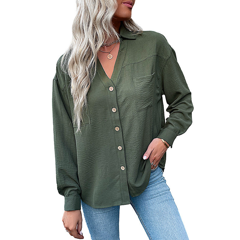 Women's blouse with a relaxed fit and decorative button details, size [size missing]