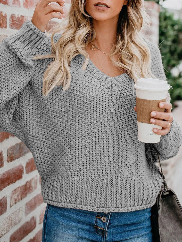Women's chunky knit sweater with deep V-neck and relaxed fit, size