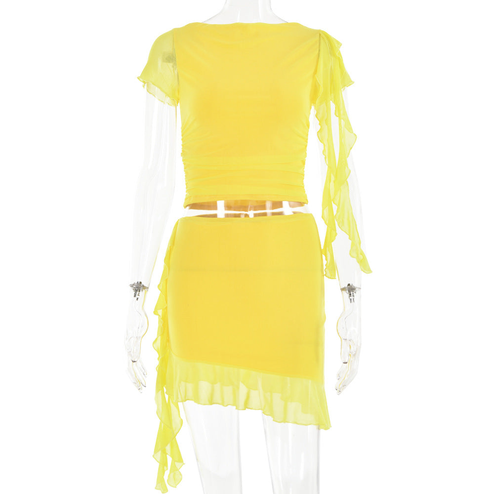 Women's crop top and mini skirt with asymmetrical hem and ruffle details, size