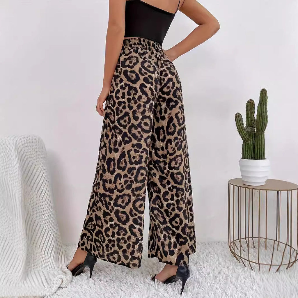 Women's wide-leg leopard print trousers in flowing material with elasticated waistband, size S