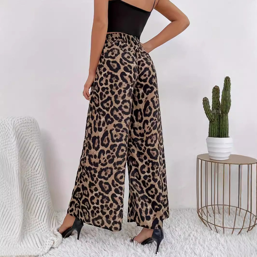 Women's wide-leg leopard print trousers in flowing material with elasticated waistband, size S